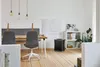 A modern office or dining area with a table, chairs, and an air purifier. Anteprima dell’immagine prodotto