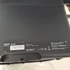 The underside of a black Epson WorkForce Pro WF-4820DWF printer, showing a label with product information, serial number, and regulatory marks. Náhled obrázku produktu