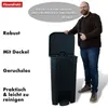 A man stands next to a black trash can with its lid open, giving a thumbs up. Voir les images du produit