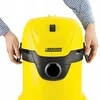 A close-up shot of a yellow Kärcher vacuum cleaner with hands holding the sides. Produktbild-Vorschau