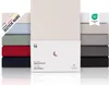 A stack of folded fitted sheets in various colors, with a product box in the foreground. Anteprima dell’immagine prodotto