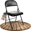 A black folding chair is displayed on a wooden circular platform against a white background. Produktbild-Vorschau