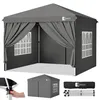 A gray pop-up canopy tent with side panels and windows, shown from the front, with smaller inset images showing assembly and a packed tent. Produktbild-Vorschau