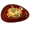 A casserole dish with broccoli and cheese on a brown plate. Produktbild-Vorschau