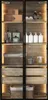 A tall, narrow display cabinet with glass doors, showcasing various bathroom or spa items on its shelves and in its drawers. The cabinet has integrated LED lighting. Anteprima dell’immagine prodotto