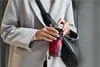 A person holding a portable blender filled with berries. Voir les images du produit
