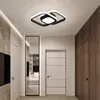 A modern hallway with a ceiling light, a full-length mirror, and wooden doors. Produktbild-Vorschau