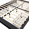 Close-up view of the internal structure of a bed frame, showing wooden slats and metal supports. Náhľad obrázku produktu