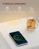 A smartphone charging on a wireless charger next to a glass of tea. Produktbild-Vorschau