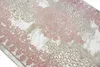 A close-up view of a rug with a vintage pattern. Produktbild-Vorschau