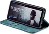 A smartphone in a teal flip case is displayed on a surface, showing a movie streaming interface on its screen. Produktbild-Vorschau