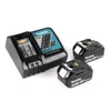 A Makita battery charger and two batteries are displayed on a white background. Náhled obrázku produktu
