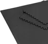 A close-up, angled view of interlocking black gym mats. Voir les images du produit