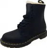 A black Dr. Martens boot with white fur lining. Podgląd zdjęcia produktu
