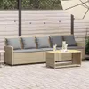 An outdoor patio scene with a beige rattan sofa and coffee table. Náhled obrázku produktu