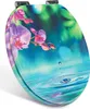 A toilet seat with a floral and water droplet design. Produktbild-Vorschau