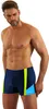 A man wearing swim shorts against a white background. Podgląd zdjęcia produktu