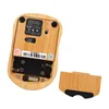 The underside of a bamboo computer mouse with the battery cover removed, showing the battery compartment and a USB receiver. Produktbild-Vorschau