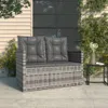A poly rattan garden bench with grey cushions is placed on a patio next to a building. Produktbild-Vorschau