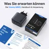 A Voomy M665 charger, its packaging, and a user manual are displayed on a white and light gray background. Produktbild-Vorschau