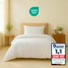 A white duvet and pillow set on a bed in a bedroom setting. Produktbild-Vorschau