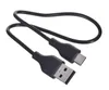 A black USB-C to USB-A charging cable is shown against a white background. Náhled obrázku produktu