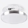A close-up, angled view of a modern LED ceiling light fixture against a plain background. The fixture has a white diffuser and a brushed aluminum trim. The top part of the fixture, showing the LED board and wiring, is slightly detached. Produktbild-Vorschau