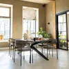A dining room scene with a table and chairs, set for a meal. Produktbild-Vorschau