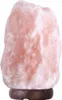 A pink Himalayan salt lamp on a wooden base. Náhled obrázku produktu