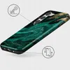 A phone case with an emerald and gold marbled design is shown from a diagonal angle. Produktbild-Vorschau