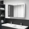 A modern bathroom vanity with a double sink and a mirrored medicine cabinet above. Produktbild-Vorschau