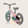 A close-up view of the rear section of a pink balance bike, with a circular overlay highlighting a specific design detail. Produktbild-Vorschau