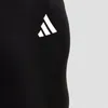 A close-up of black athletic wear with the Adidas logo. Produktbild-Vorschau