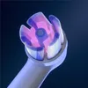 Close-up of an electric toothbrush head with purple and pink bristles. Anteprima dell’immagine prodotto