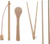 A collection of wooden kitchen utensils arranged on a white background. Produktbild-Vorschau