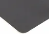 A close-up view of the corner of a black desk mat with a textured surface. Produktbild-Vorschau
