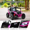 A child is happily riding in a pink and black electric toy car outdoors. Anteprima dell’immagine prodotto