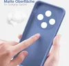 A hand is touching a blue phone case, highlighting its matte surface and soft grip. Produktbild-Vorschau