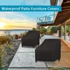 Two black patio furniture covers are shown on a patio with a view of a body of water and a sunset in the background. Produktbild-Vorschau