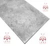 A close-up, angled view of a gray, speckled panel with logos in the corners. Produktbild-Vorschau