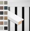 A white trim piece is shown diagonally across the image, with a grid of smaller sample swatches of different wood and color finishes for acoustic panels on the left side. The background features blurred vertical black and white stripes. Produktbild-Vorschau