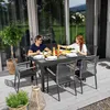 A couple is enjoying a meal at an extendable outdoor dining table on a wooden deck. Náhled obrázku produktu
