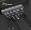 A close-up view of a docking station with various cables and accessories plugged in, showcasing its ports and connectivity options. Produktbild-Vorschau