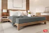 A bedroom scene with a bed, nightstand, and dresser. Produktbild-Vorschau