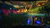A first-person view of a video game environment, showing a weapon in the foreground and a landscape with buildings and creatures in the background. Náhled obrázku produktu