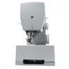 A side view of a gray sewing machine against a white background. Anteprima dell’immagine prodotto