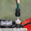 A hand is connecting a garden hose to a pump attachment. Anteprima dell’immagine prodotto