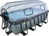An above-ground swimming pool with a clear cover and a gray patterned liner, supported by a black metal frame.