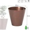 A copper-colored planter with dimensions and capacity indicated, next to a white planter with a bonsai tree. Náhľad obrázku produktu