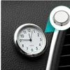 Silberne runde Armaturenbrettuhr fürs Auto mit weißem Zifferblatt und schwarzen Zahlen, zeigt 11:58 Náhled obrázku produktu